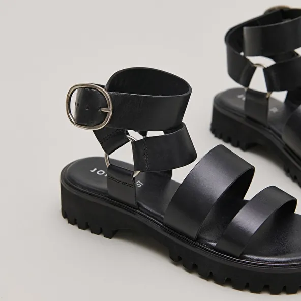 Platform sandals with buckles in black leather