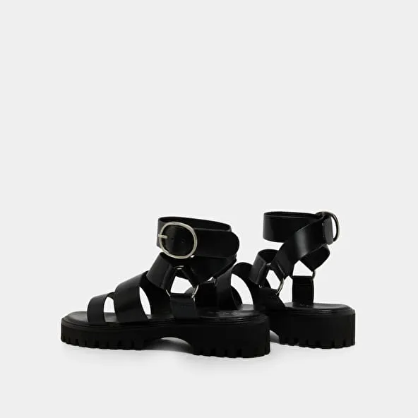 Platform sandals with buckles in black leather